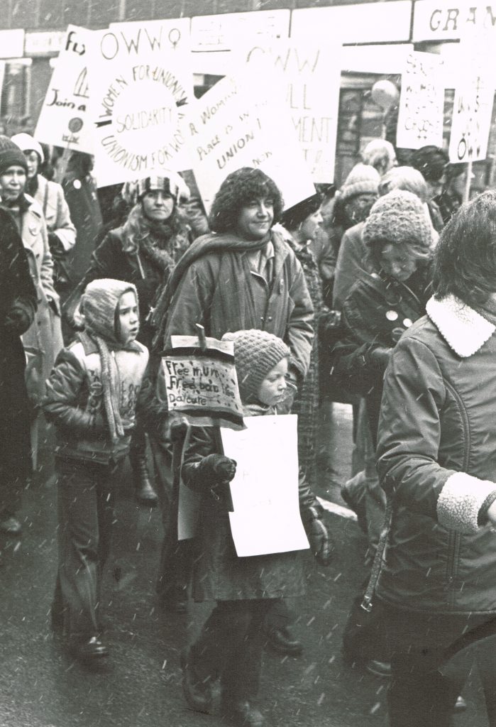 Deirdre Gallagher and daughter with the Organized Working Women contingent at the 1978 International Women's Day March in Toronto.