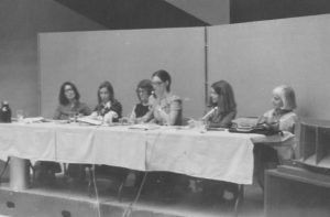 The 1976 National Association of Women and the Law conference marked the start of the United Nations Decade of Women. This panel includes speakers Evelyn Gigantes, Lynne Kaye, Laurell Ritchie, Cathy Morrison,and Helen Levine. The conference was likely the first national conference for NAWL.