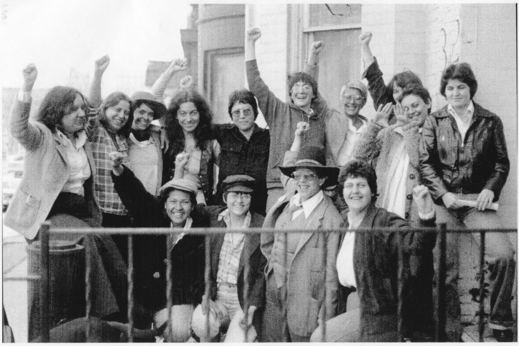 This group photo of the organizing team for the 1979 Bi-national Lesbian Conference held in Toronto was taken outside the Lesbian Organization of Toronto (LOOT).