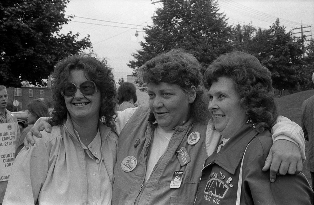 Arlene Mantle is photographed with two other women activists and union members at the 1986 support rally for United Bank Workers Local on strike against CIBC VISA.