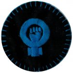 This fabric patch uses the clenched, raised fist combined with a Venus symbol to represent Feminism. This remains an iconic symbol of the women’s liberation movement.