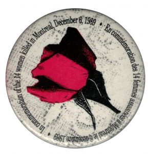 This button commemorates the murder of 14 women, just because they were women, at L'École Polytechnique in Montreal on December 6, 1989. Although many other buttons have been designed by various groups, this button is one of the most well-recognized and worn.