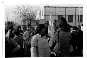 Deirdre Gallagher of Organized Working Women speaks to reporter at Fleck Solidarity Action.