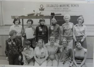 The first Executive of Organized Working Women, elected at the Founding Convention. Those in the photo are: (l to r) Back Row: Fiona Sim(?) Barb Cameron, Shelly Acheson, Evelyn Armstrong (1 st President), Joan Morris, Bottom Row: Kathy Skinner, Kathy Beeman, Elizabeth Smith, Lois Bedard, April Coulton, Margaret DalyPhotograph of 1st Organized Working Women Executive elected at Founding Convention l to r Back Row: Fiona Sim(?) Barb Cameron, Shelly Acheson, Evelyn Armstrong (1 st President), Joan Morris, Bottom Row: Kathy Skinner, Kathy Beeman, Elizabeth Smith, Lois Bedard, April Coulton, Margaret Daly