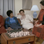 Still from the film "Older, Stronger, Wiser" featuring four older black women sitting in a living room and talking.