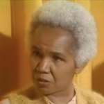 Still from a 1980 interview featuring Rosemary Brown, an older black woman with cropped white hair.