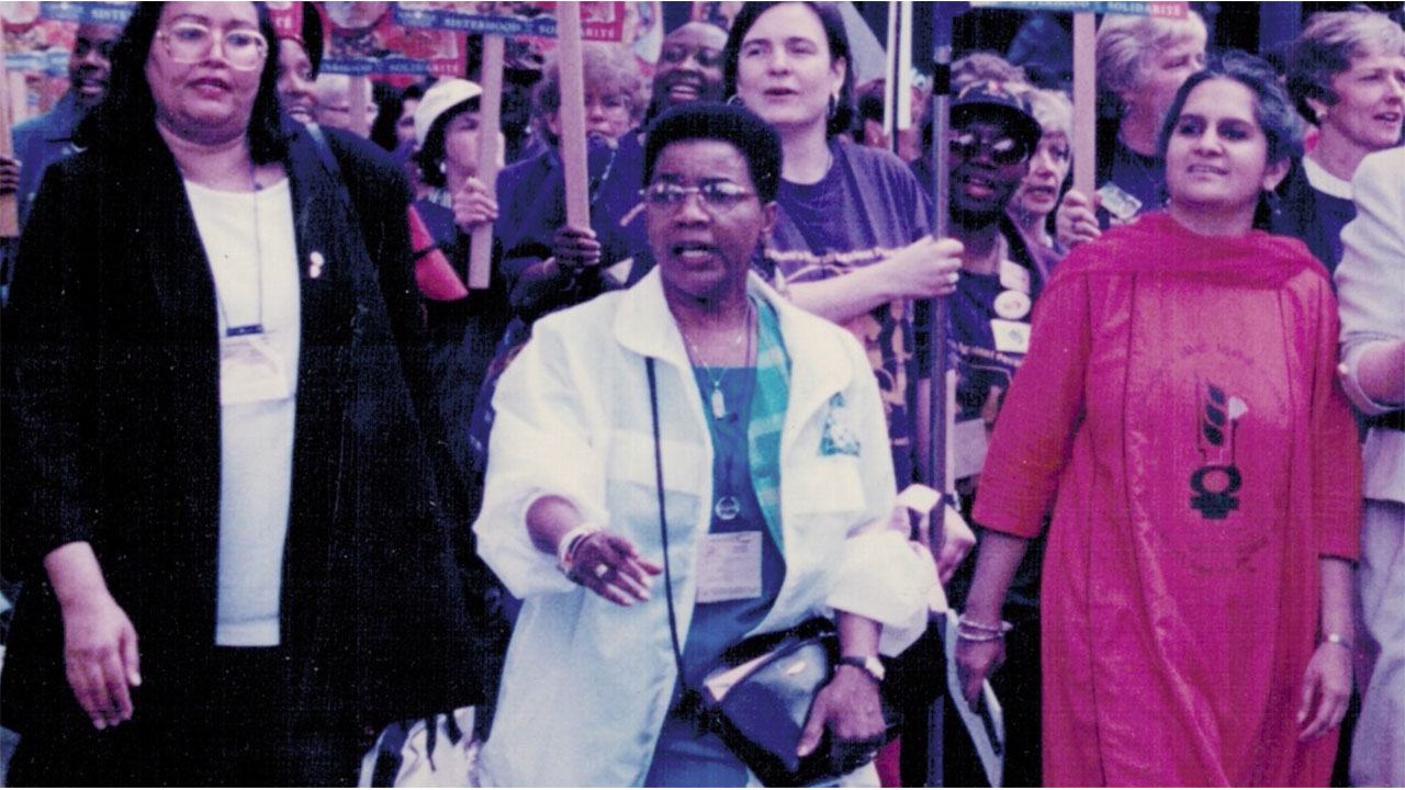 Still from video of June Veecock at IWD in Toronto