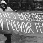 Photo of one section of the Banner Project and featuring the message, "Toutes ensemble pour un pouvoir féministe". Women's groups across Canada were asked to produce a protest banner that would become part of a huge banner in Ottawa. The goal was to show the strength and solidarity of women during the Third Commonwealth meeting of Ministers Responsible for Women’s Affairs in October 1990.