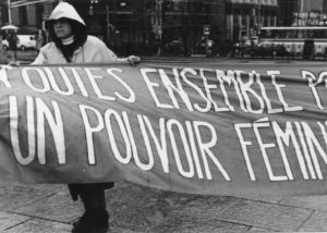 Photo of one section of the Banner Project and featuring the message, "Toutes ensemble pour un pouvoir féministe". Women's groups across Canada were asked to produce a protest banner that would become part of a huge banner in Ottawa. The goal was to show the strength and solidarity of women during the Third Commonwealth meeting of Ministers Responsible for Women’s Affairs in October 1990.