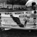 The slogan of the Port Alberni Women's Centre banner was "Rural women need access to...." along with a list that included jobs, education, social services, and housing. It was part of the Banner Project which asked women's groups across Canada to produce a protest banner that would become part of a huge banner in Ottawa. The goal was to show the strength and solidarity of women during the Third Commonwealth meeting of Ministers Responsible for Women’s Affairs in October 1990.