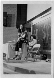 Photo taken at the 1973 Feminist Symposium Féministe in Montreal. Anne Cools, an organizer of the symposium, chaired the opening night session where Selma James spoke about “Revolutionary Feminism and the Kitchen”. (l to r) Selma James, Anne Cools