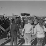 Women join hands in solidarity at an Abortion Caravan event during a stop en route to Ottawa.