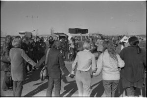 Women join hands in solidarity at an Abortion Caravan event during a stop en route to Ottawa.