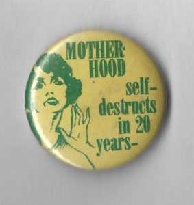 This is an undated humorous button on motherhood.