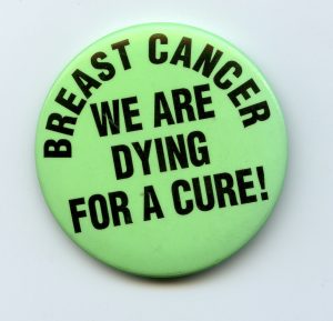 The slogan raises the need for attention to research into breast cancer and treatments.