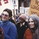 Photo of Carolyn Egan at a Toronto International Women's Day March. Carolyn has been an organizer for the Toronto March 8th events since this date was reclaimed by feminists in the late 1970s.