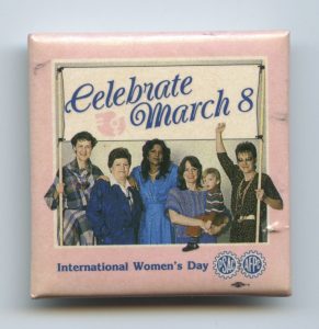 The Public Service Alliance of Canada (PSAC) created this button to celebrate March 8th International Women's Day. The button portrays the diversity and unity of women members across the PSAC.