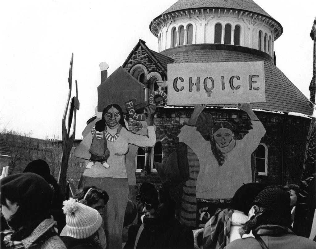 This undated photo was taken at an IWD March in Toronto. The images highlight the themes of Choice and Fighting Poverty. Photograph by Amy Gottlieb.