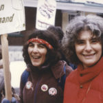 Shelley Glazer and Sheila Miller walk with Free Abortion on Demand placard at 1982 International Women's Day March in Toronto.