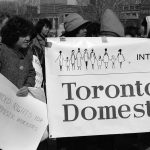 A photo of the INTERCEDE contingent and banner at 1990 International Women's Day March in Toronto.