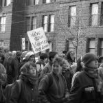 Placards at the 1990 International Women's Day March in Toronto focus on ending violence against women and children. Photograph by Amy Gottlieb.