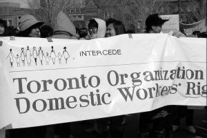 The Toronto Organization for Domestic Workers' Rights (INTERCEDE) banner at the 1990 Toronto International Women's Day March.