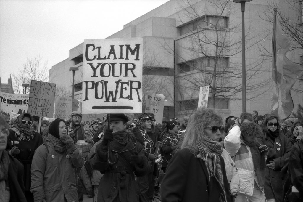 The placard at the 1990 International Women's Day March in Toronto calls on women to Claim Your Power. Photograph by Amy Gottlieb.