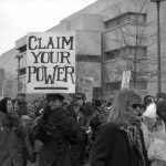 The placard at the 1990 International Women's Day March in Toronto calls on women to Claim Your Power. Photograph by Amy Gottlieb.