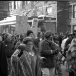 Photo from the 1990 International Women's Day March in Toronto shows demonstrator with Take Back the Night placard.