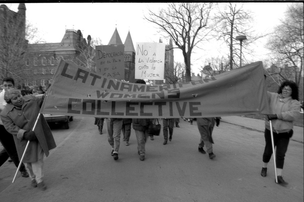 A photograph of the Latin American Women's contingent and banner at the Toronto IWD March in 1990.