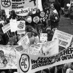 Banners for the Federation of Women Teachers' Association of Ontario and the Congress of Canadian Women are seen contingents at the 1983 International Women's Day March in Toronto.