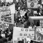 Participants in 1983 International Women's Day March in Toronto call for action and solidarity with Polish workers and the people of El Salvador and Nicaragua.