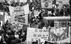 Participants in 1983 International Women's Day March in Toronto call for action and solidarity with Polish workers and the people of El Salvador and Nicaragua.