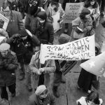 Banners at the 1983 International Women's Day March in Toronto call for Political Status for Irish Prisoners and Status for Irish Women in Armagh Gaol .