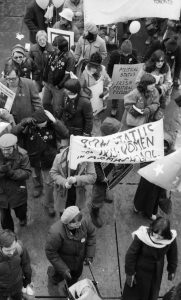 Banners at the 1983 International Women's Day March in Toronto call for Political Status for Irish Prisoners and Status for Irish Women in Armagh Gaol .