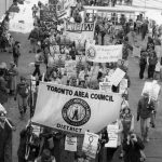 United Steelworkers Toronto Area Council march at the International Women's Day 1983 March in Toronto. Banners of other unions can also be seen in the background.