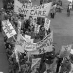 Action Day Care and Metro Toronto Daycare Workers march at the 1983 International Women's Day March in Toronto. The Osgoode Women's Caucus is also in the photo.