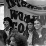 This undated photograph of International Women's Day Committee banner was taken at a Toronto International Women's Day Rally. IWDC activists Linda Briskin and Lynda Yanz are shown.