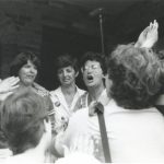 This photo was taken at the 1983 raid of the Toronto Morgentaler clinic and shows Judy Rebick speaking to protesting women. The Toronto clinic, opened in June by Dr. Morgentaler, was raided in July and police charged Drs. Morgentaler, Scott and Smoling with conspiracy to procure a miscarriage.