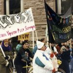 Women from Lesbian Youth Peer Support and Sistering join Toronto International Women's Day March.