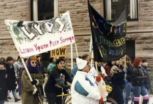 Women from Lesbian Youth Peer Support and Sistering join Toronto International Women's Day March.