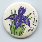 Irises in bloom decorate the button for British Columbia's Lesbian Celebration in 1983.