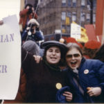 Lois Fine and Anne-Marie Smith hold Lesbian Power placard at Toronto International Women's Day March.