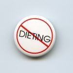 This button protests the persistent social pressure on women to diet and the idea they should aspire to be thin.