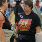 This photo is one of a number taken at the Oka Peace CamThis photo is one of a number taken at the Oka Peace Camp set up in July 1990 in solidarity with the Mohawks of Kanehsatake who rose up in defense of their ancestral lands after the Oka Golf Club proposed an extension and the building of luxury condos over a Mohawk ancestral graveyard in the sacred wooded area known as “The Pines”. This land had never been ceded. In early July, after the Mohawks refused to end their non-violent occupation of the area or to take down the barricade, the Sûreté du Québec (Quebec police) moved in resulting in a violent confrontation. Later, the Canadian army was called in. Mohawk women, including Ellen Gabriel, played a central role in the uprising, which lasted for 78 intense days (July 11 – September 26, 1990). In the end, the golf course was not extended, and the condos were not built. But the larger issues of land sovereignty have never been resolved.p set up in July 1990 in solidarity with the Mohawks of Kanehsatake who rose up in defense of their ancestral lands after the Oka golf course proposed an extension and the building of luxury condos over a Mohawk ancestral graveyard in the sacred wooded area known as “The Pines”. This land had never been ceded. In early July, after the Mohawks refused to end their non-violent occupation of the area and to take down the barricade, the Sûreté du Québec (Quebec police) moved in resulting in a violent confrontation. Later, the Canadian army was called in. Mohawk women, including Ellen Gabriel, played a central role in the uprising, which lasted for 78 intense days (July 11 – September 26, 1990). In the end the golf course was not extended and the condos were not built. But the larger issues of land sovereignty have never been resolved.