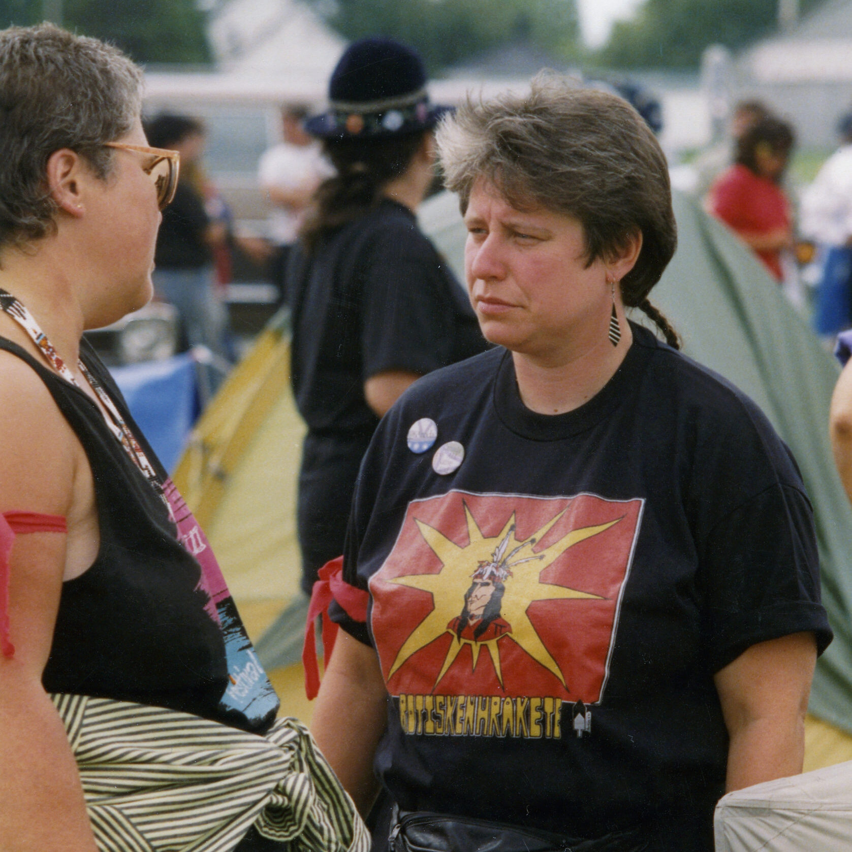 This photo is one of a number taken at the Oka Peace CamThis photo is one of a number taken at the Oka Peace Camp set up in July 1990 in solidarity with the Mohawks of Kanehsatake who rose up in defense of their ancestral lands after the Oka Golf Club proposed an extension and the building of luxury condos over a Mohawk ancestral graveyard in the sacred wooded area known as “The Pines”. This land had never been ceded. In early July, after the Mohawks refused to end their non-violent occupation of the area or to take down the barricade, the Sûreté du Québec (Quebec police) moved in resulting in a violent confrontation. Later, the Canadian army was called in. Mohawk women, including Ellen Gabriel, played a central role in the uprising, which lasted for 78 intense days (July 11 – September 26, 1990). In the end, the golf course was not extended, and the condos were not built. But the larger issues of land sovereignty have never been resolved.p set up in July 1990 in solidarity with the Mohawks of Kanehsatake who rose up in defense of their ancestral lands after the Oka golf course proposed an extension and the building of luxury condos over a Mohawk ancestral graveyard in the sacred wooded area known as “The Pines”. This land had never been ceded. In early July, after the Mohawks refused to end their non-violent occupation of the area and to take down the barricade, the Sûreté du Québec (Quebec police) moved in resulting in a violent confrontation. Later, the Canadian army was called in. Mohawk women, including Ellen Gabriel, played a central role in the uprising, which lasted for 78 intense days (July 11 – September 26, 1990). In the end the golf course was not extended and the condos were not built. But the larger issues of land sovereignty have never been resolved.