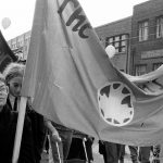 Members of The Women's Press carry a banner at the October 22, 1983 “Refuse the Cruise” protest organized by the Toronto Disarmament Network (TDN) and the Against Cruise Testing Coalition (ACT). The International Women’s Day Committee was one of many groups to support the march.