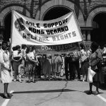 This is an undated photo of welfare rights protest at Queen's Park features banner of Sole Support Moms.