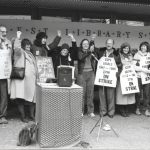 Members of the three bargaining committees rallied the Metro Toronto Library workers on the morning of their return to work after the successful conclusion of their two-month strike. (November 26, 1984). From the left: Cameron Holyer and Peggy Keefe (CUPE 1806 bargaining committee), Anne Richmond (CUPE 1582 bargaining committee), Mindy Ginsler (President CUPE 1806), Sue Genge (President CUPE 1582), Ken Morton (President CUPE 2758), Sheila Mackay (CUPE 1582 bargaining committee), Alma Hyslop (CUPE 1806 bargaining committee).