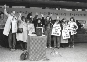 Members of the three bargaining committees rallied the Metro Toronto Library workers on the morning of their return to work after the successful conclusion of their two-month strike. (November 26, 1984). From the left: Cameron Holyer and Peggy Keefe (CUPE 1806 bargaining committee), Anne Richmond (CUPE 1582 bargaining committee), Mindy Ginsler (President CUPE 1806), Sue Genge (President CUPE 1582), Ken Morton (President CUPE 2758), Sheila Mackay (CUPE 1582 bargaining committee), Alma Hyslop (CUPE 1806 bargaining committee).